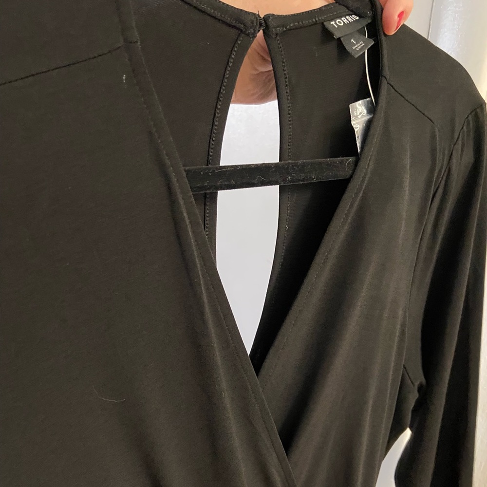 Torrid—Black and beige stripe capri-length jumpsuit. New with tags.